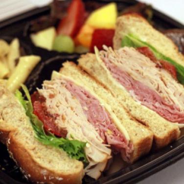 Club sandwich: swiss cheese, rosemary ham, bacon, smoked turkey, tomato, lettuce, mayonnaise on challah roll