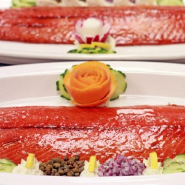 Smoked Salmon Presentation served with cucumber dill sauce, capers, red onion, lemon garnish
